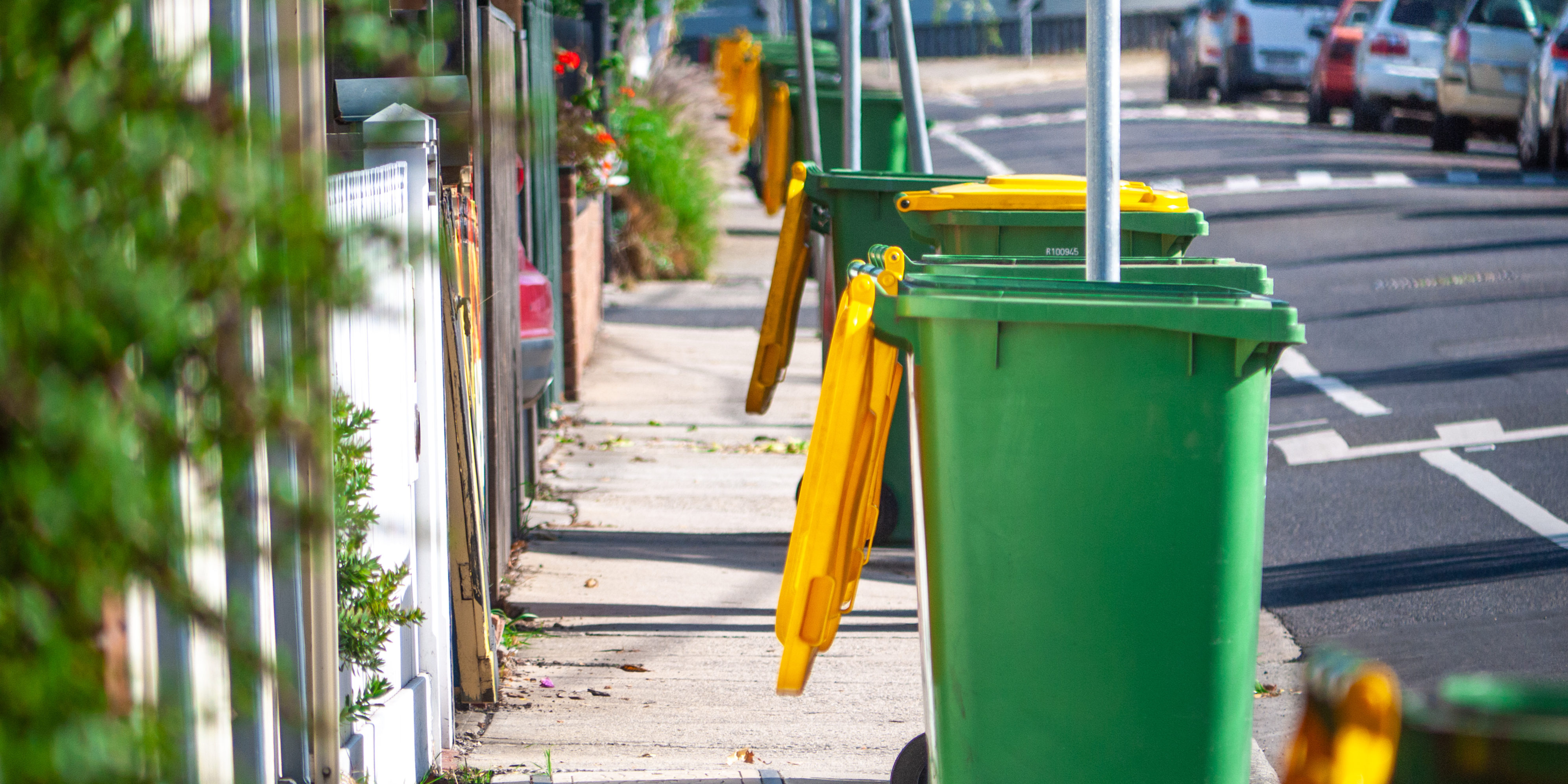 Collected kerbside waste bins on typical Australian suburban street. Footscray, VIC Australia.
