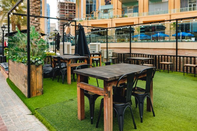 Empty table and chairs of street cafe