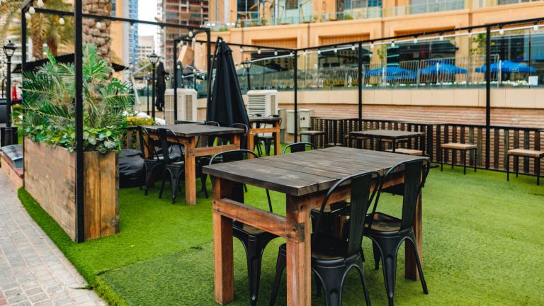 Empty table and chairs of street cafe
